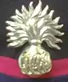 Grenade worn by SNCOs of all sub units in forage cap, and Band and Drums in the beret