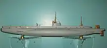 Less than 10 years after HMS Holland 1 entered service, the British B-class submarine shows the transition in hull form from submarine to diving surface vessel. The bow is slightly raised, as is the stern above the two propellers.
