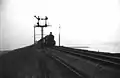 Steam locomotive NS 5014 (ex War Department no. 73676) with a train near Moerdijk. (1948)