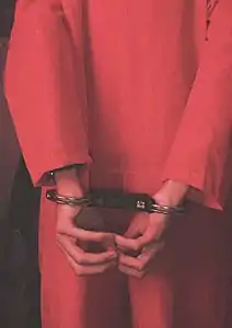 Handcuffed to the back