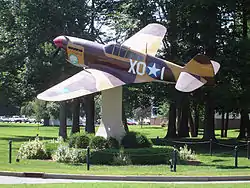 A replica Curtiss P-40 Warhawk on static display at Hanscom AFB.