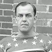 Black and white photo of Emms as an ice hockey player with the New York Americans