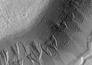 Gullies in the wall of Harmakhis, as seen by HiRISE.