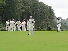 81 year old batter walking back off the cricket field