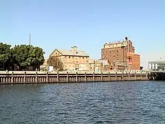 Hart's Mill (1855, centre) and the Adelaide Milling Company flour mill (c.1890, right) are prominent landmarks adjacent to the southern wharf of the Inner Harbour at Port Adelaide.34°50′33.2″S 138°29′58.4″E﻿ / ﻿34.842556°S 138.499556°E﻿ / -34.842556; 138.499556