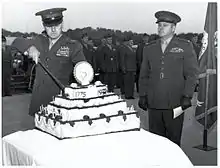 Franklin A. Hart cuts a cake for The Basic School while David M. Shoup looks on in 1951. Note that this cake has candles.