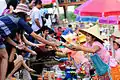 Hawker selling food to customer, Khlong Hae floating market, southern Thailand