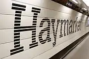 A platform at Haymarket, branded in the new corporate colour scheme.