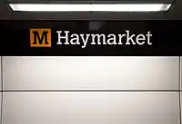 Station signage at Haymarket, branded in the new corporate colour scheme.