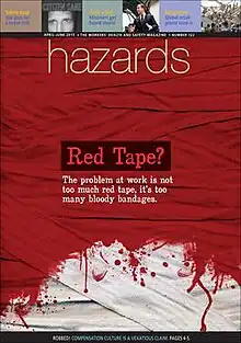 Interwoven strips of cloth mostly stained red, fading to white near the foot of the image. The caption says "Red tape? The problem at work is not too much red tape, it's too many bloody bandages".