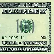 A half-image of a US $100 bill that features the band's name and song title.