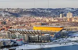 Heinz Field on the North Shore, with the Ohio River visible in the foreground and the Carnegie Science Center to the left.