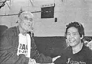 Bunasawa as a sports journalist with Hélio Gracie