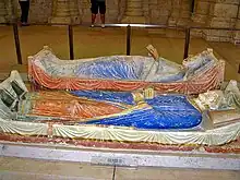 Painted statues of reclining king and queen