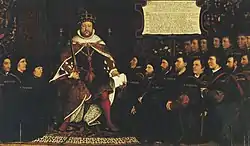 King Henry VIII in full royal regalia surrounded by a kneeling group of men who are all wearing black clothing and some with matching close-fitting caps