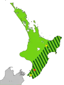 Map of the North Island of New Zealand coloured light green with dark green stripes from the central mountains to the sea along the east coast to Wellington, and one red and two yellow dots.