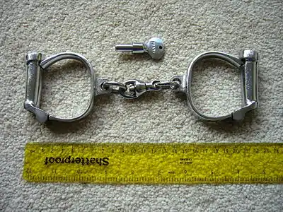 Hiatt type 104 "Darby" handcuffs and key. Circa 1950s