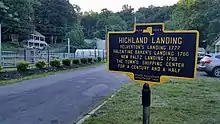 a picture of the marker with the Yelverton house behind it