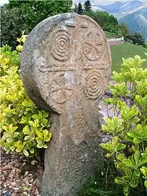 A disc shaped gravestone or hilarri in Bidarray, western Pyrenees, Basque Country, featuring typical geometric and solar forms, as it was the custom since the period previous to Roman times