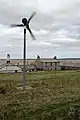 A wind turbine and houses