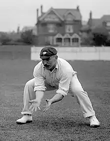 A cricketer catching