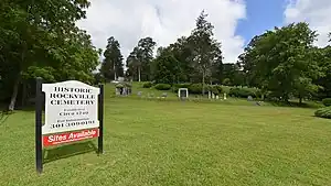 Photo of cemetery with cemetery's sign