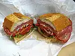 A submarine sandwich, which includes a variety of Italian luncheon meats