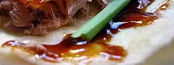 Hoisin sauce on a Peking duck wrap