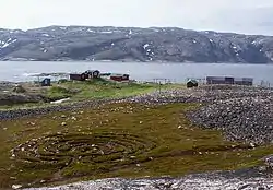 View of the village with the labyrinth in the foreground