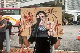 Artwork that alludes to the August 11 incident when a female protester's eye was allegedly injured by a bean-bag round shot by the police