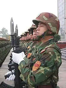 Chinese soldier with QBZ-95 rifle and multi-purpose knife bayonet.