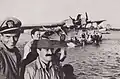 Hope, Thomas and tour Consolidated PBY Catalinans emergency landing in Australia in 1944. US Navy pilot James Ferguson standing beside Jerry Colonna with moustache and Bob Hope in the background on the Camden Haven River in Laurieton, New South Wales.