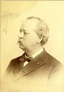 Right facing head and shoulders sepia toned photo of Horace Holmes Thomas