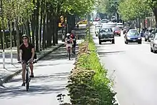 Group of cyclists using a bike lane in Vancouver, Canada