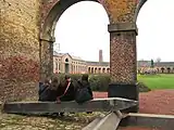 View of the oval courtyard and the statue of H. de Gorge, who early in the 19th century built the mining complex of Grand Hornu, which is an example of functional town-planning and evidence of the importance of the Industrial Revolution in Wallonia.