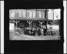 Horse-drawn wagons at the corner of B Street NW and 7th Street NW
