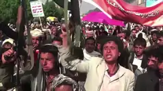 Protesters with slogan placards