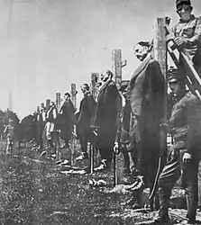Austro-Hungarian soldiers executing Serbian civilians during World War I (1916).