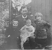 Photo of Hugh with the 3 children at Draycot in 1919