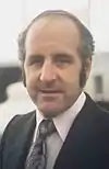 Portrait of Denny Hulme looking at the camera