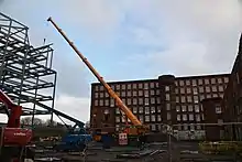 Photograph of construction equipment at the site of Hunslet Mills, Leeds