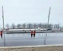 Light rail tracks installed along a roadway in a separate right of way.