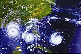 A combination of three satellite views of Hurricane Andrew: approaching Florida, emerging into the Gulf of Mexico, and approaching Louisiana