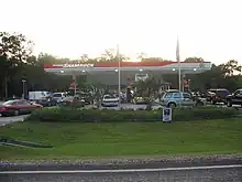 Photograph of cars at a gas station