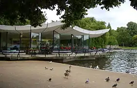The brutalist architecture of the Dell Restaurant, situated on the northern end of the dam, dominates the eastern end of the lake.