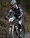 cyclist on bike on a mountain trail