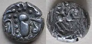 An anonymous silver drachma (perhaps from the North Konkan Silaharas) dating from the 11th-12th centuries. This kind of currency was found in the district of Nimar of Madhya Pradesh and in the Huzur Jawhirkhana of Indore. Dimension: 14 mm Weight: 4.4 g. of Shilahara