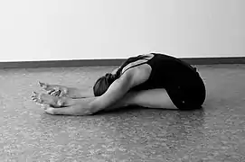 Caterpillar pose, the Yin version of Paschimottanasana: in Yin Yoga, poses are held for an average of five minutes to improve flexibility and restore a fuller range of motion.