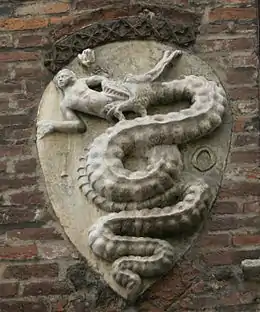 The House of Visconti coat of arms on the Archbishops' palace in Piazza Duomo bearing the initials (IO.<HANNES>) of the name of Archbishop Giovanni Visconti.