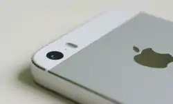 The back of an iPhone 5s, displaying the camera and Apple logo.